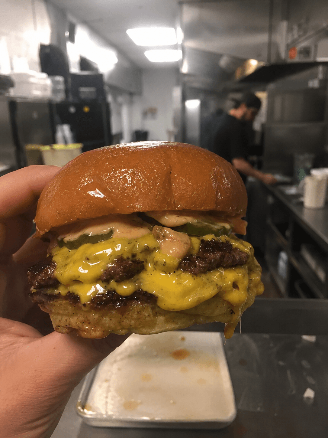 Raw phone photo of smash burger